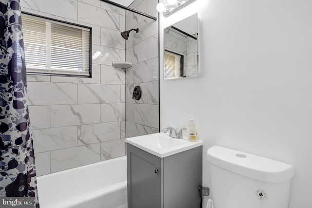 bathroom featuring toilet, shower / bathtub combination with curtain, and vanity