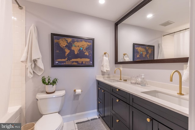 bathroom featuring visible vents, a sink, toilet, and tile patterned floors