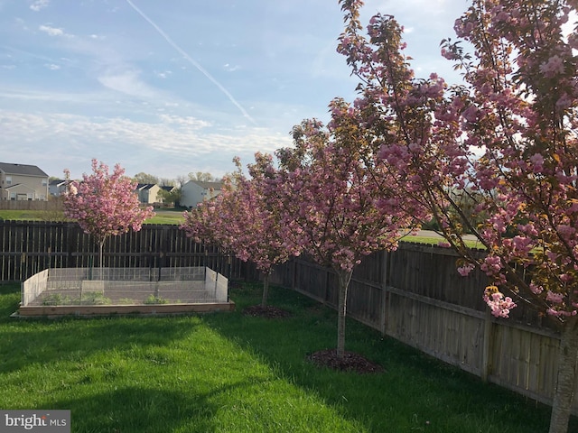 view of yard featuring a garden and fence