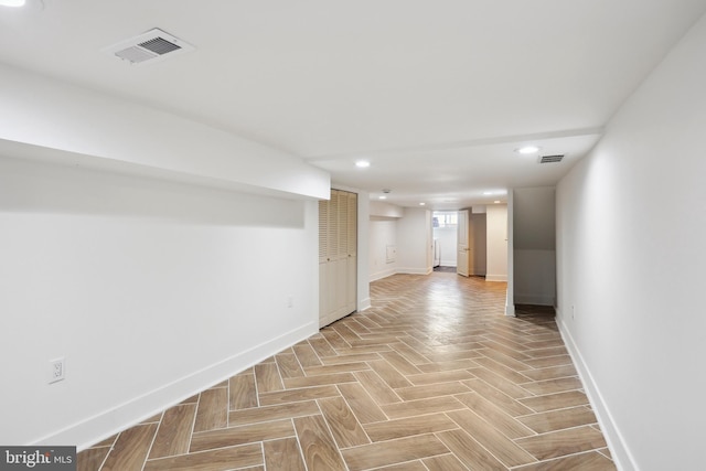 basement featuring recessed lighting, visible vents, and baseboards