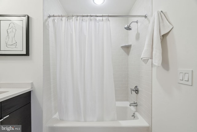 bathroom featuring vanity and shower / bath combo