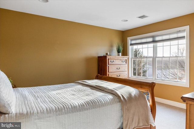 bedroom with visible vents, baseboards, and carpet floors