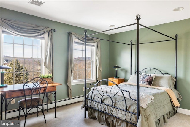 bedroom with visible vents, carpet flooring, baseboards, and a baseboard radiator