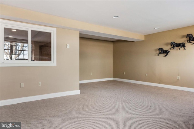 spare room with recessed lighting, baseboards, and carpet floors