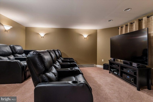 cinema with baseboards, a baseboard radiator, and light carpet