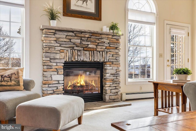 interior space with carpet flooring, a fireplace, and baseboard heating