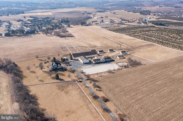 birds eye view of property with a rural view