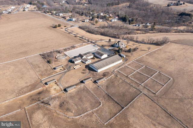 birds eye view of property with a rural view