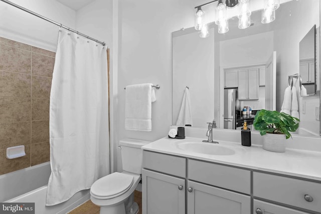 bathroom with shower / bath combination with curtain, vanity, and toilet