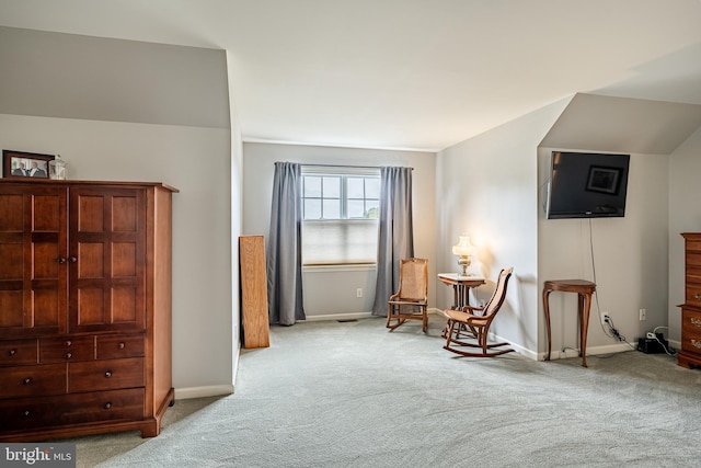 sitting room with light colored carpet and baseboards