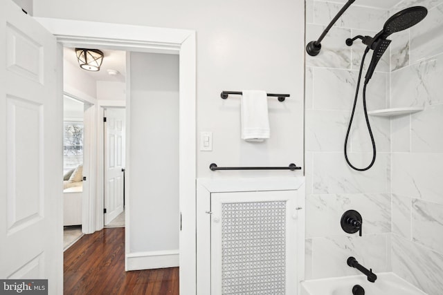 full bath with shower / tub combination and wood finished floors