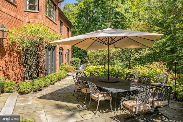 view of patio featuring outdoor dining area