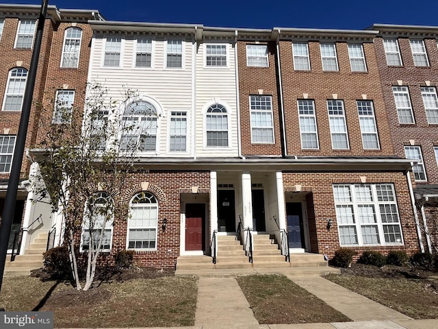 view of property featuring brick siding