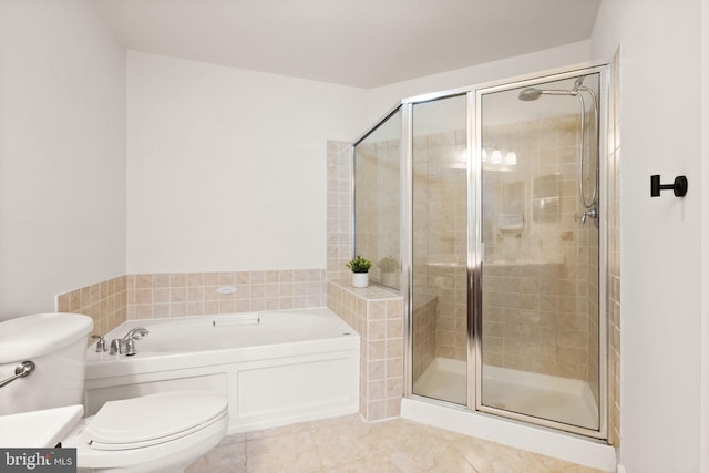 full bath with a stall shower, a garden tub, toilet, and tile patterned floors