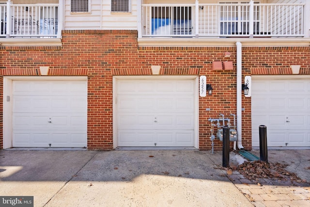 garage featuring driveway