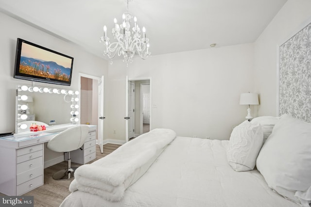 bedroom with light wood finished floors and baseboards