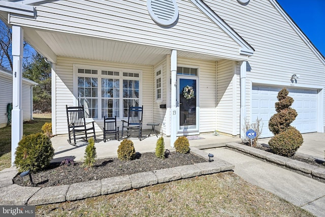 exterior space featuring a garage and a porch