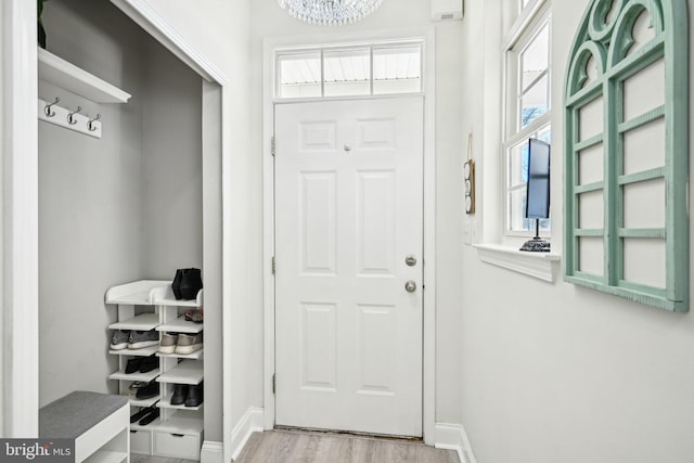 mudroom featuring baseboards and wood finished floors