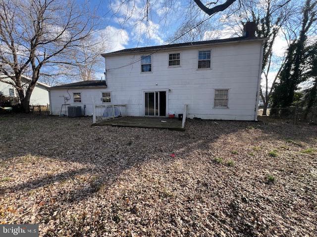 rear view of property with a chimney, fence, cooling unit, and a patio