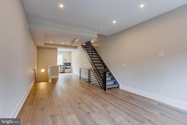 interior space featuring light wood-style floors, recessed lighting, and baseboards