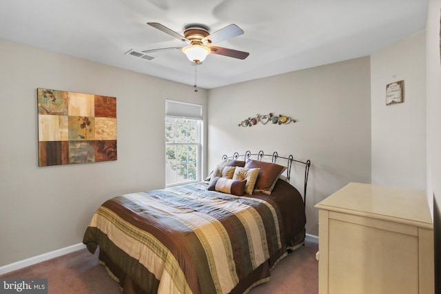 carpeted bedroom with visible vents, ceiling fan, and baseboards