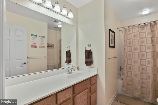 full bathroom with toilet, vanity, visible vents, tile patterned floors, and shower / tub combo with curtain