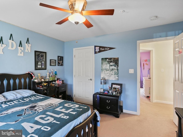 bedroom featuring a ceiling fan, carpet, and baseboards