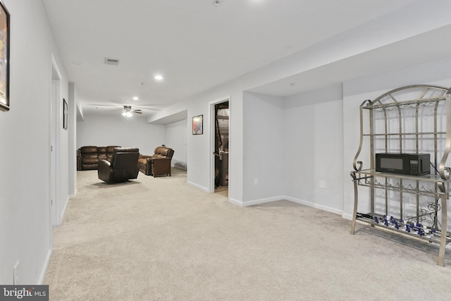 interior space featuring a ceiling fan, recessed lighting, visible vents, and baseboards