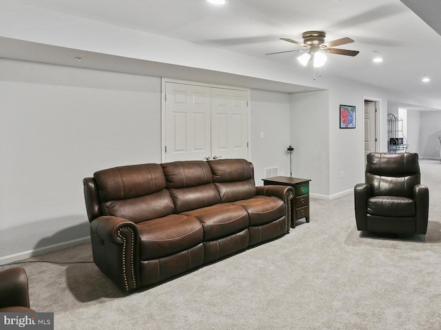 carpeted living area with visible vents, baseboards, and recessed lighting