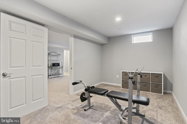 workout room with carpet floors and baseboards