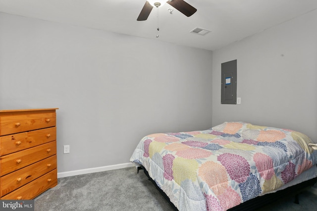 carpeted bedroom featuring baseboards, electric panel, visible vents, and ceiling fan