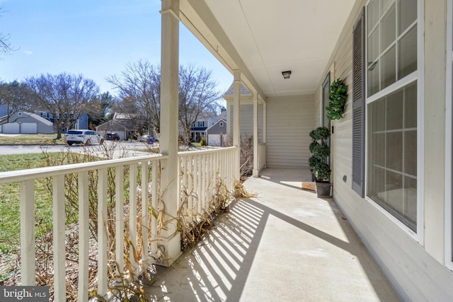 balcony featuring a porch and a residential view