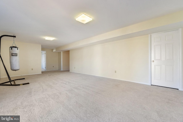 finished basement featuring carpet and baseboards