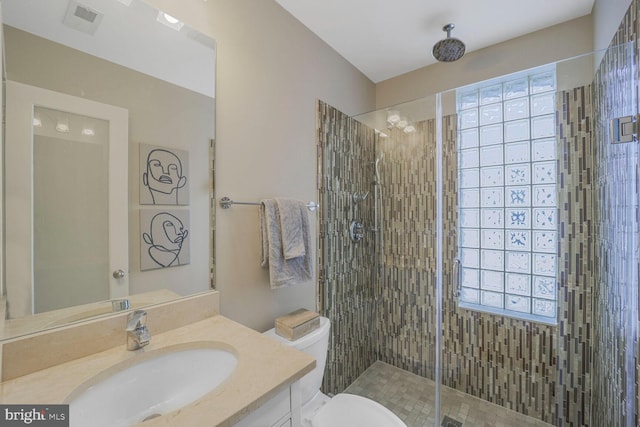 full bath featuring visible vents, a shower stall, toilet, and vanity