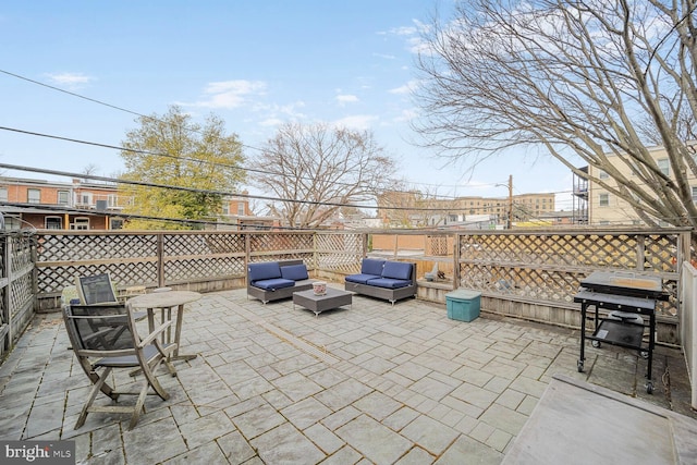 view of patio with a grill and an outdoor hangout area