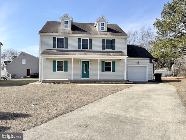 view of front of property with covered porch, driveway, and an attached garage