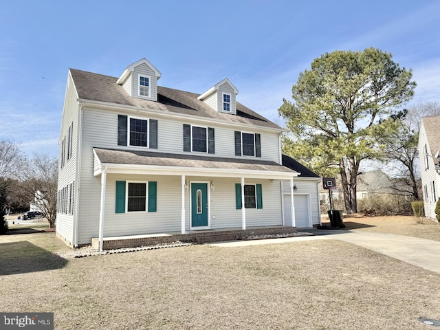 view of front of home featuring covered porch, driveway, and an attached garage