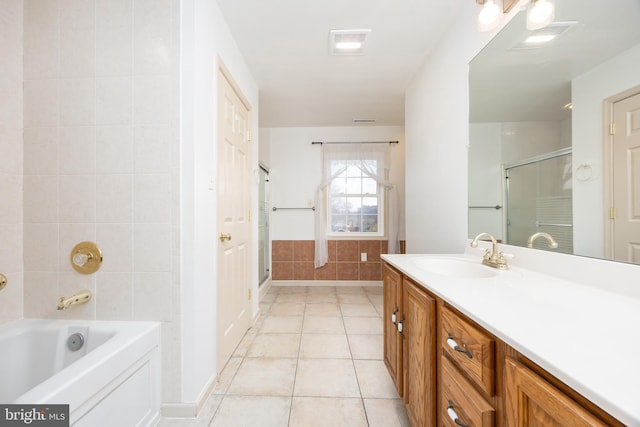 full bath featuring a tub to relax in, visible vents, tile patterned flooring, vanity, and a shower stall