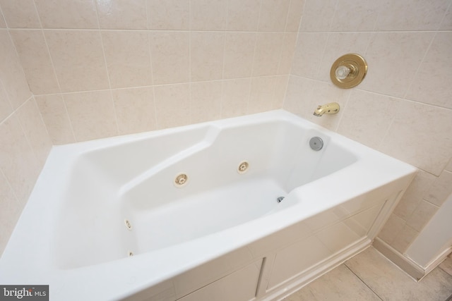 full bathroom with tile patterned flooring and a whirlpool tub