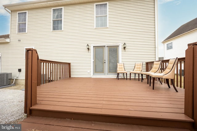 wooden terrace featuring central AC unit