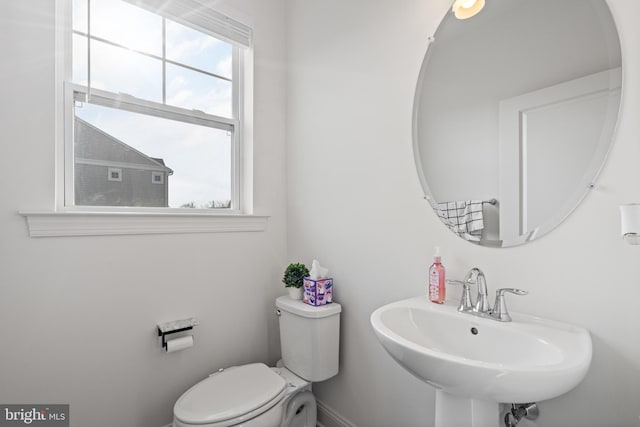 bathroom with toilet and a sink