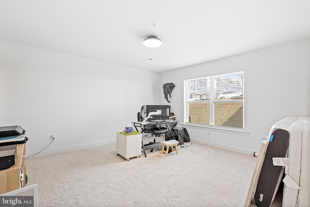 carpeted office with baseboards