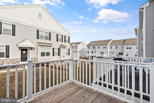 wooden terrace featuring a residential view