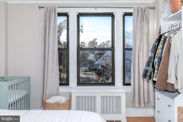 bedroom featuring radiator