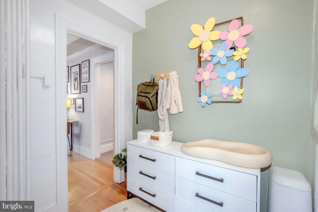 bathroom with wood finished floors and vanity