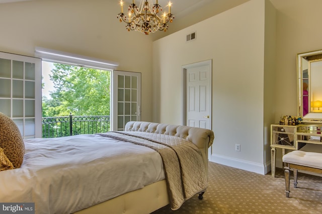 carpeted bedroom with a chandelier, visible vents, baseboards, and a towering ceiling