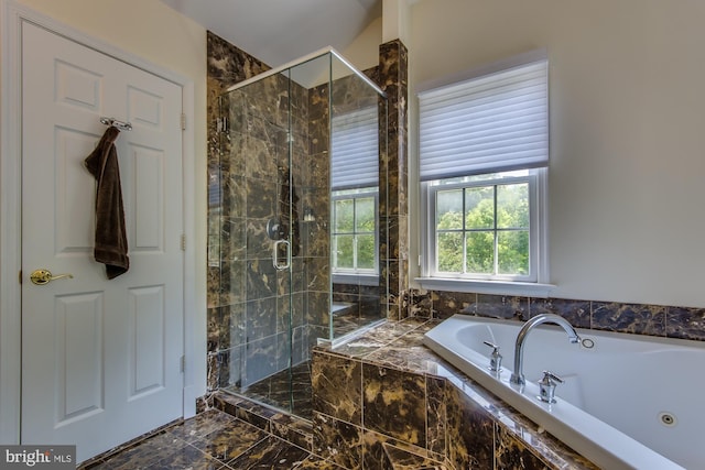 full bathroom featuring a shower stall and a bath