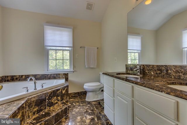 full bath featuring visible vents, toilet, a sink, double vanity, and a bath