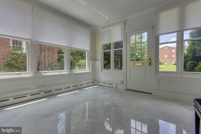 unfurnished sunroom with a baseboard radiator