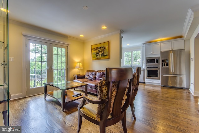 living room with baseboards, ornamental molding, recessed lighting, french doors, and wood finished floors